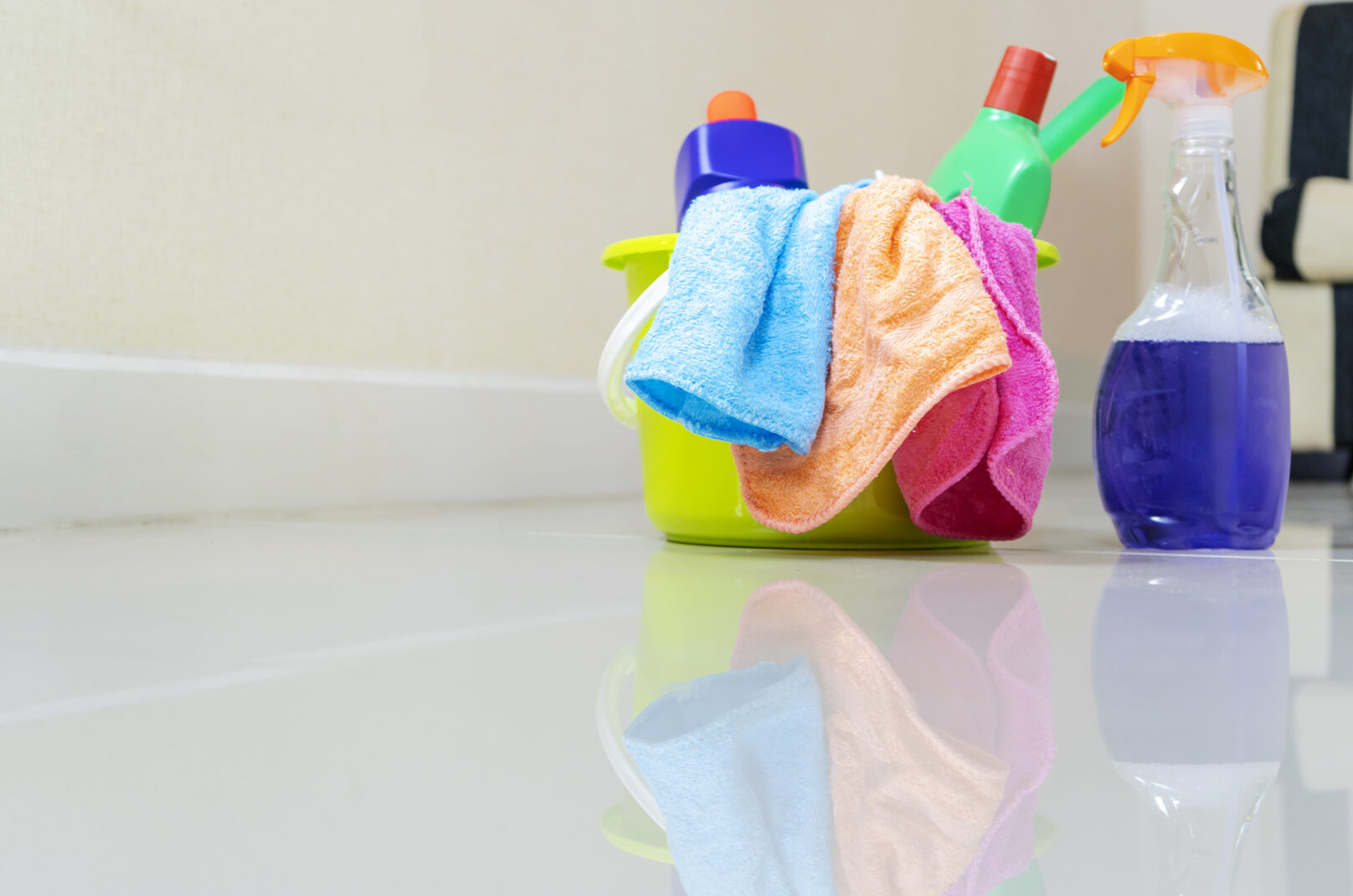 Cleaning service. Bucket with sponges, chemicals bottles and mopping stick. Rubber gloves and towel. Household equipment.